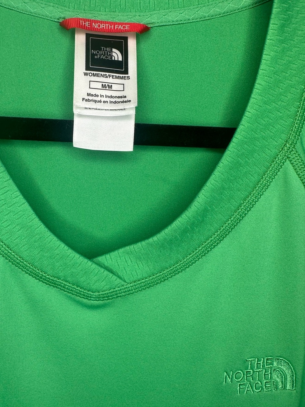The North Face Women's V-Neck Short Sleeve Tee in Green.